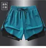 Venta al por mayor del fabricante Exportación transfronteriza Pantalones cortos de seda helada para hombre Verano Tres puntos Pantalones deportivos de playa Secado rápido Correr Fitness Entrenamiento