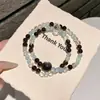 Pulseira de Obsidiana Prateada Natural Lápis-lazúli Círculo Duplo Atacado Simples Original Mais Vendida para Homens Mulheres Casais Pulseira de Contas Budistas Brincos Culturais