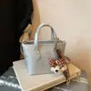 Bolso de Mano de Estilo Coreano de Moda Transfronterizo Bolso Cubo para Mujer Verano 2026 Nuevo Bolso de Hombro Texturizado de Color Sólido Bolso Cruzado para Viajar