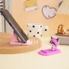 Novo suporte de celular Sanrio desenho animado desktop legalomi pequena decoração boneca máquina melody pequeno presente atacado