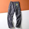 Calça casual de trabalho retrô estilo americano para homens, modelagem solta, design simples, com múltiplos bolsos, adequada para primavera e outono, corte reto e afunilado na barra