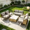 Conjunto de sofá, mesa e cadeiras de aço inoxidável de luxo para escritórios de vendas, vilas, condomínios residenciais, pátios, hotéis e pousadas; combinação externa, à prova d'água e resistente ao sol