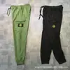 Pantalones Funcionales de Marca de Moda Stone Island Transfronterizos con Bolsillos Laterales con Logo Jogger Estilo Americano Pantalones de Chándal Versátiles Corte Holgado Ropa de Trabajo