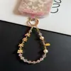 Cadena Creativa para Teléfono Móvil con Temática de Texto, Cuentas de Cristal de Aleación, Correa de Muñeca, Colgante Rojo de Año Nuevo