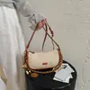 Bolso de Axila para Mujer 2026 Nuevo de Moda Súper Popular Exquisito Bolso de Hombro para Viajes de Negocios Bolso Cruzado Versátil de Verano