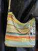 Bolso Tejido de Moda con Bloques de Color para Mujer 2026 Primavera Nuevo Estilo Ins Simple Casual Bolso Cubo Elegante Bolso de Hombro