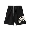 Nuevos shorts deportivos para hombre con parche de boca de tiburón, pantalones holgados hasta la rodilla, pantalones casuales de moda para la playa, pantalones deportivos de baloncesto