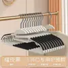 Perchero de ropa doméstico de doble soporte para dormitorio, de pie, ancho de hombro grueso, no deja marcas, protege el cuello, colgador de plástico multifuncional