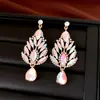 Pendientes elegantes europeos y americanos de lujo ligero con incrustaciones de diamantes de imitación, pendientes largos de cristal brillantes y lujosos, pendientes de moda para novia para mujer