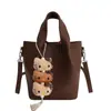 Bolso Cubo de Estilo Coreano de Nicho para Mujer Modelo Nuevo Primavera 2026 Bolso de Hombro Cruzado Elegante de Gama Alta