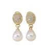 Aretes Lochen de zirconita micro-pavimentada con gota de agua y perla de imitación, un accesorio lujoso y elegante para atuendos formales y banquetes