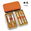 Regalo del Fabricante Logo Impreso Color Caramelo Juego de 7 Piezas de Cortauñas Caja de Cuero Belleza Herramientas de Manicura Tijeras para Uñas