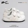 Huili WXY(S)-5997Z Tênis de Treino Alemão Feminino 2026 Primavera Novo Modelo Biqueira Reforçada Velcro Tênis Branco para Mulheres