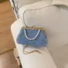Elegante y con Estilo Nuevo Bolso de Mano Metálico Floral para Mujer 2026 Moda Simple para la Noche Bolso Tote de Hombro Cruzado con Perlas