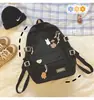 26 modelos nuevos de mochilas, versión coreana, estilo Harajuku, simples y versátiles, gran capacidad, adecuadas para estudiantes de secundaria, color liso, diseño lindo