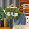 Conjunto de Verano para Niños 2026 Modelo Nuevo Conjunto Delgado de Verano para Bebés y Niños con Mangas Cortas de Rayas Anchas y Auriculares Conjunto de Dos Piezas Venta al por Mayor