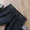 Nuevos jeans de alta gama para hombre 2023 otoño e invierno lavado blanco europeo cintura media-alta elásticos holgados rectos