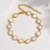 Novo modelo de comércio exterior, sensação de luxo leve e alta qualidade, pulseira de concha de abalone, pulseira de aço inoxidável com concha branca iridescente, requintada e versátil, atacado