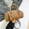 Bolsa de mão de boliche feminina única 2026 novo modelo de primavera bolsa de ombro simples transversal bolsa almofada da moda