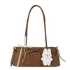 Bolso baguette de encaje con lazo de moda para mujer, bolso cilíndrico fresco de nicho, bolso pequeño de moda versátil de un solo hombro para llevar debajo del brazo