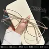 Nuevo Marco de Gafas Danyang K5013 Moderno Marco Ovalado para Mujer Gafas para Miopía Marco de Gafas Oro Rosa Titanio Puro Ultraligero