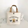 Bolsa de Lona Urso Estilo Novo 2025 Bolsa Térmica Portátil Bolsa de Mão Artística de Desenho Animado Bolsa de Presente para Mulheres