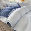 Oferta especial estilo lujo ligero transmisión en vivo color sólido conjunto de cuatro piezas para dormir desnudo nórdico simple cepillado agradable a la piel ropa de cama de la fábrica de Nantong