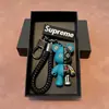 Llavero de coche de oso mecánico de alta gama de moda regalo personalizado para pareja muñeco tridimensional colgante de bolso pequeño regalo