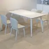 Mesa y sillas de comedor de placa de roca blanca pura nórdica para uso en hogares pequeños, mesa de comedor negra pura minimalista de lujo ligero de alta gama, nueva mesa de comedor negra pura
