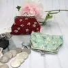 Nuevo monedero pequeño de tela fresca estampado a cuadros billetera corta pequeña bolsa de boca dorada souvenirs turísticos al por mayor