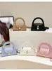 Bolso de nicho transfronterizo, nuevo bolso de hombro semicircular para mujer, bolso cruzado versátil tipo retro para el día a día con cierre de hebilla, bolso de moda