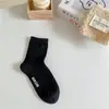 Meias femininas outono e inverno Novas cor pura Meias femininas de cano médio ins sola da moda letra estampada a quente rosto sorridente meias femininas simples casuais