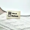 En stock Nuevo Algodón Puro Marca de Estampado Estampado a Mano Dibujo Animado Etiqueta Lavable Cinturón de Algodón Blanco Ropa Infantil Marca Tejida Marca Registrada