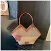 Bolso de mano tejido de nicho transfronterizo 2026 nuevo bolso de hombro retro versátil de gran capacidad con textura para el trabajo bandolera