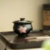 Cerámica negra, tinta plana, diseño de lirio, pintura al agua pura, tapa ribeteada en oro, cuenco de té de gran capacidad, cuenco con infusor de té, juego de té de cerámica, cuenco de té