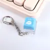 Dispositivo de eje de prueba mérito más una llave llavero luminoso acumulador de llaves colgante tapa de llave electrónica botón juego de descompresión
