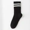 Calcetines para mujer para otoño e invierno, calcetines de algodón a rayas de punto trenzado de color liso hasta la pantorrilla, calcetines versátiles casuales adelgazantes para mujer al por mayor