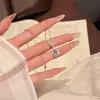 Collar Colgante de Lágrima Blanco Plateado para Mujer 2026 Nuevo Estilo Artículo Popular Diseño de Alta Gama Personalidad Versátil Clavícula