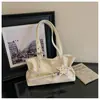 Nova bolsa de ombro retro em couro oleado para comércio exterior para mulheres, bolsa tote estilosa e moderna com alta capacidade, design de nicho popular