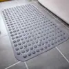 Alfombrilla de ducha de silicona engrosada, antideslizante, con características de masaje y secado rápido, adecuada para baños y aseos, con un diseño de masaje de pies