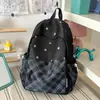 Mochila nueva estilo coreano ins de alta apariencia, fresca, dulce y relajada, con estampado de estrellas, para estudiantes de secundaria y preparatoria, bolsa ligera de doble hombro