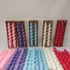 Vela espiral multicolor con forma de varilla, ideal para cenas, bodas y dulces.