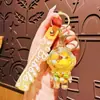 Astronauta Jelly Bean Botella Flotante Colgante para Mochila Astronauta de Dibujos Animados Llavero para Coche Regalo Pequeño para Pareja Venta al Mayoreo