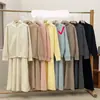 Conjunto de Dos Piezas: Chaqueta Suéter de Color Sólido con Doble Cremallera + Falda de Punto 2025 Nuevo Traje de Suéter Otoño e Invierno para Mujer