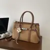 Bolso de mano de lujo ligero de nicho para comercio exterior para mujer, nuevo, estilo retro para el trabajo, para el día a día, de un solo hombro, cruzado