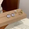 Nuevos Postes de Aretes Ovalados de Circonia Bicolor Dorado y Plateado para Mujer Personalidad Simple Dulce Fresco Sentido del Diseño Moda Versátil Aretes al por Mayor