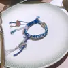 Pulseira Flor Fantasma da Montanha Azul Marinho Moedas dos Cinco Imperadores Pulseira Tecida à Mão Design Étnico para Homens e Mulheres Presente