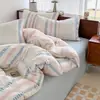 2026 Nuevo Modelo Clase A Ins Casual Jacquard Teñido en Hilo de Algodón Puro Lavado Juego de Cuatro Piezas - Escena Uno