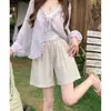 Pantalones cortos caqui de pierna ancha de alta gama estilo coreano para mujer, estilo fino de verano, estilo vacacional de playa, pantalones de cinco puntos holgados y adelgazantes