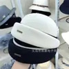 Nuevo Sombrero de Cuenca con Lazo Otoño e Invierno 2025 Estilo Coreano Literario Versátil Sombrero de Lana Negro y Blanco Sombrero de Fieltro de Cúpula